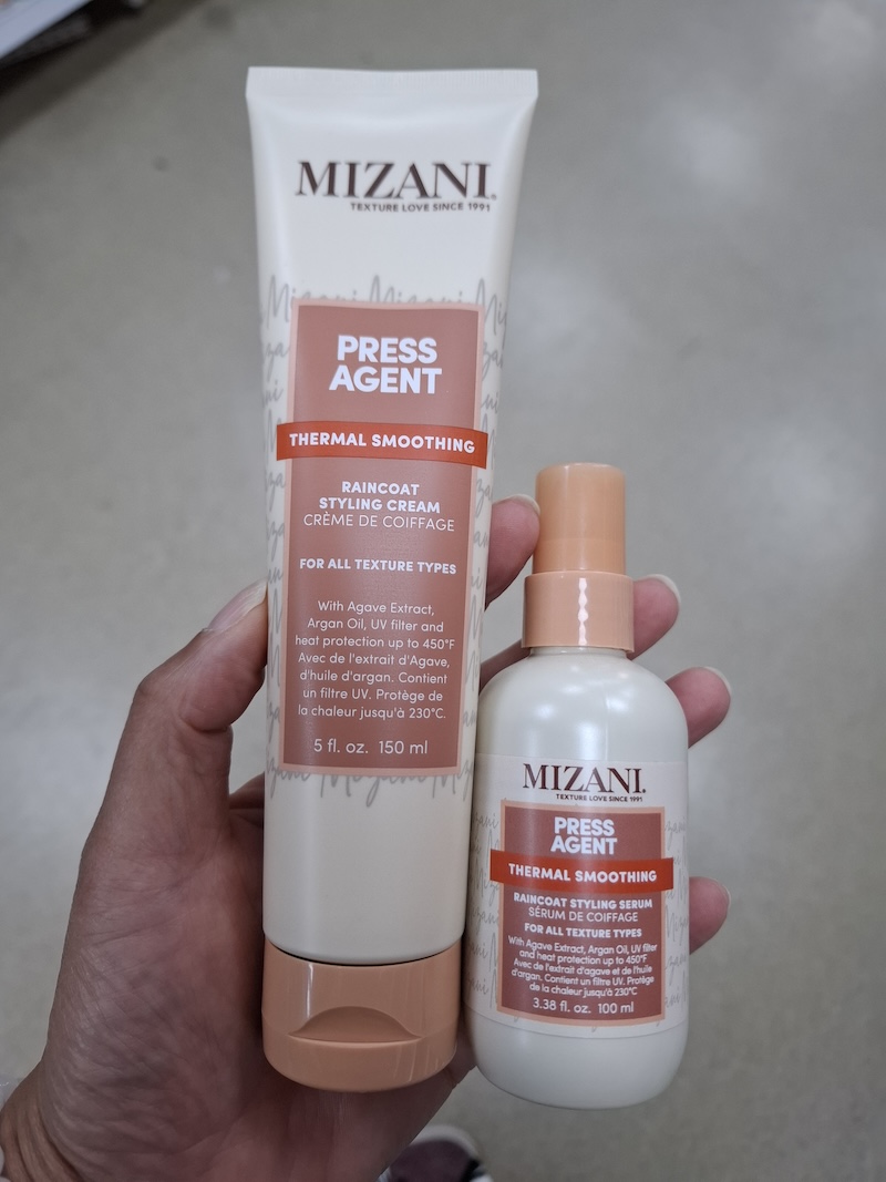 Een tube en flesje Mizani Press Agent Thermal Smoothing cream en serum